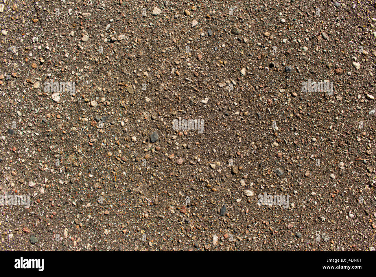 Close up detailed view of coarse asphalt road coating background or texture Stock Photo