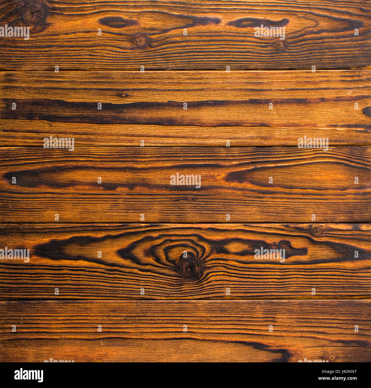 Horizontally Disposed Burnt And Stained Wood Boards With