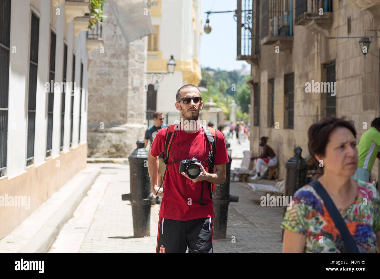 Photographer walking and looking surroundings in Havana, Cuba Stock Photo