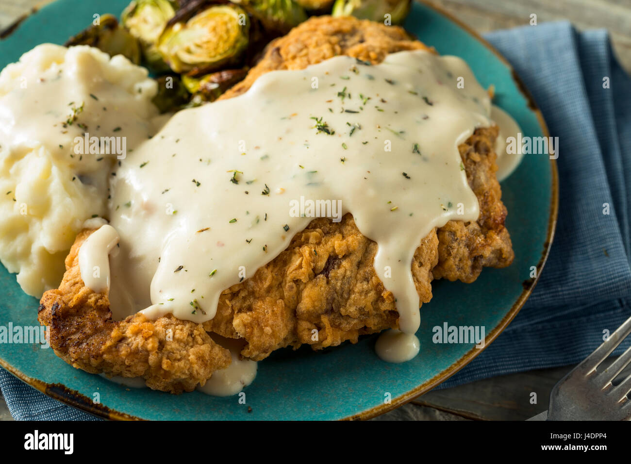 Homemade Country Fried Steak with Gravy and Potatoes Stock Photo