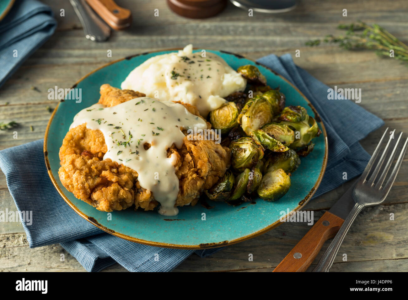 Homemade Country Fried Steak with Gravy and Potatoes Stock Photo