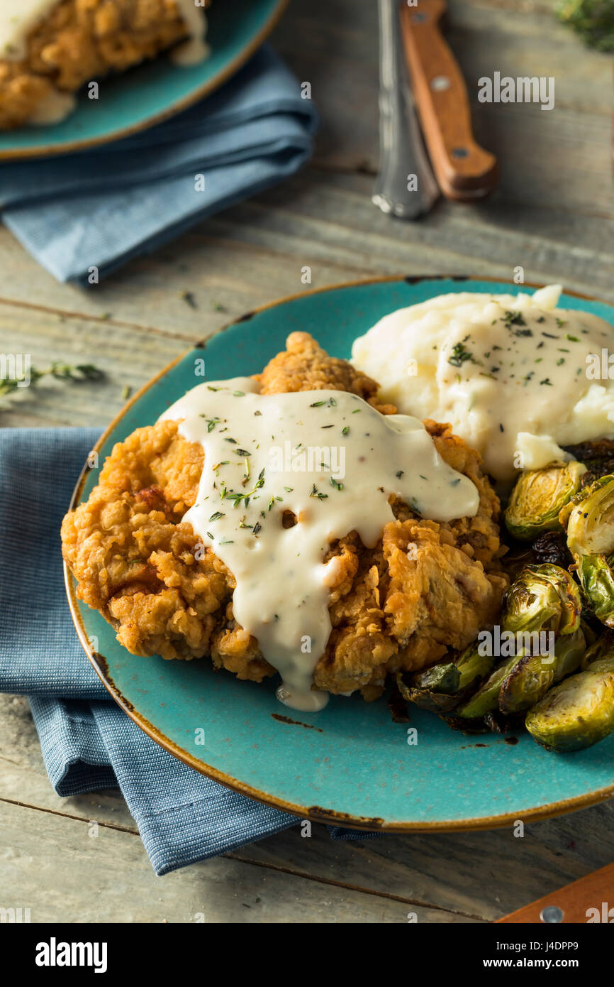 Homemade Country Fried Steak with Gravy and Potatoes Stock Photo