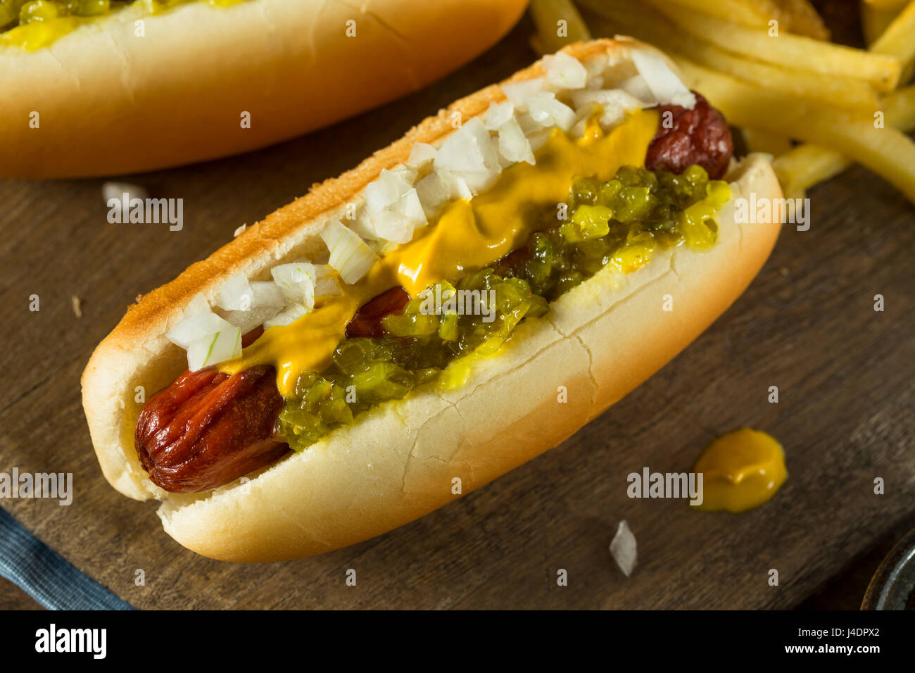 Homemade Deep Fried Hot Dogs with Mustard Onion and Relish Stock Photo