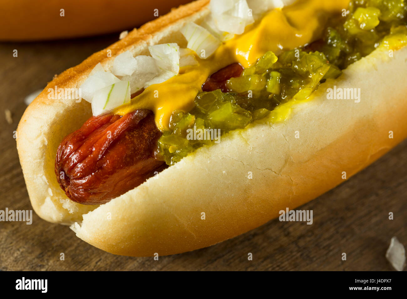Premium Photo  A hot dog with onions and mustard on it