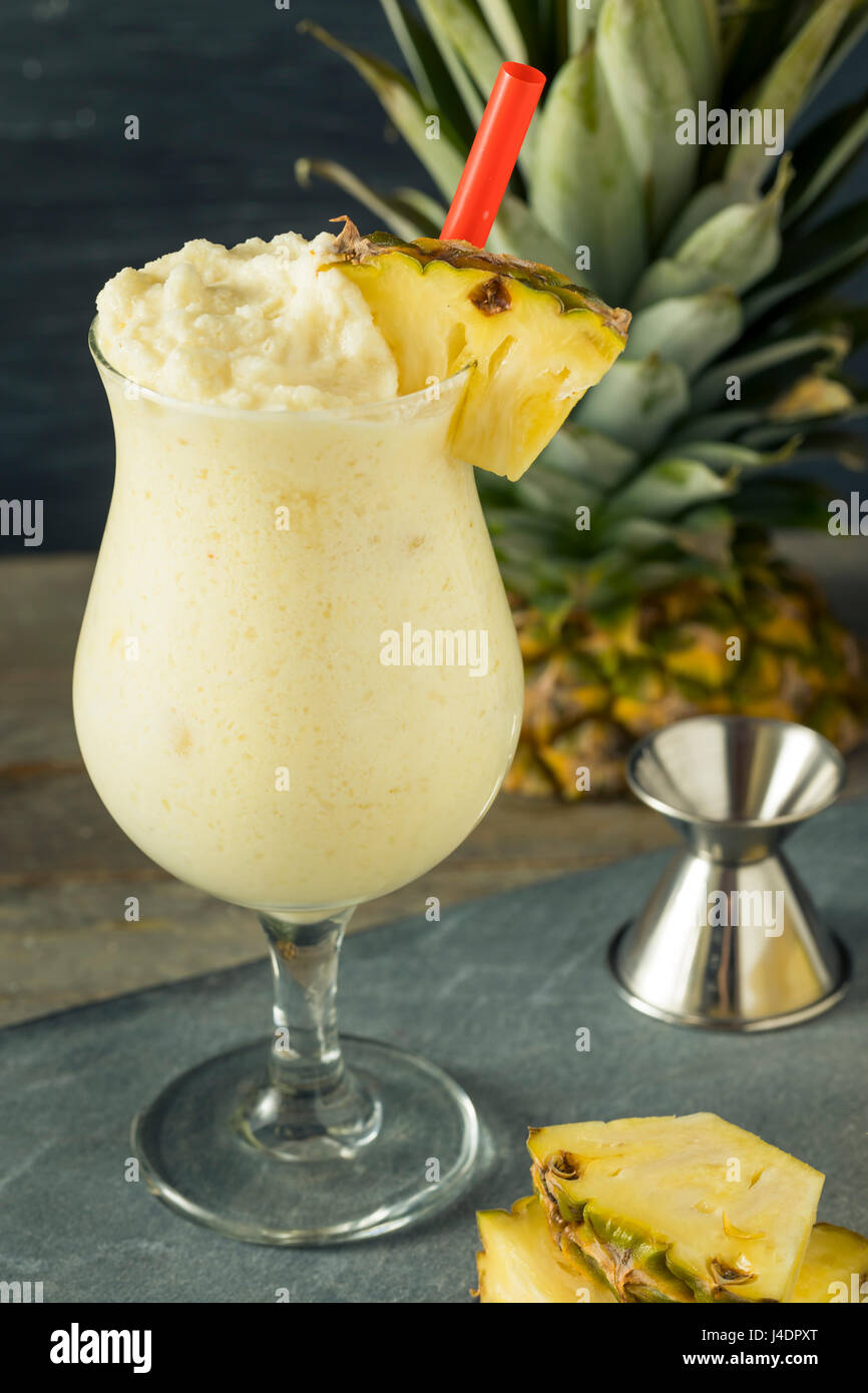 Homemade Frozen Pina Colada Cocktail with a Pineapple Garnish Stock Photo