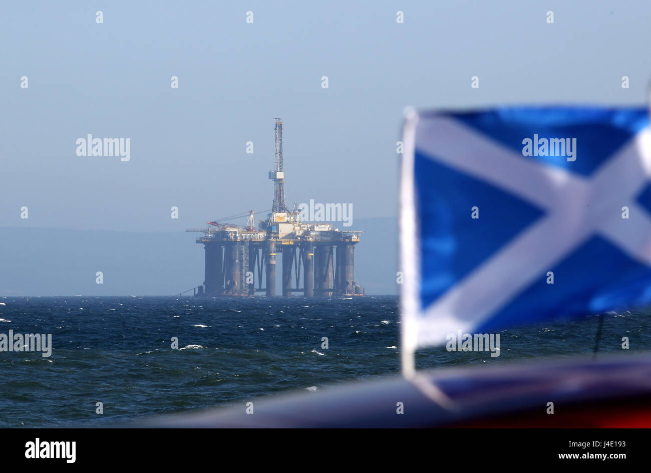 St Andrews, Scotland, UK. 11th May, 2017. Sedco 711 former North Sea oil rig moored in the Firth of Forth with a St Andrews Saltire flag flying in the sea breeze as oil prices continue to fluctuate in Scotlands interest Credit: Allan Milligan/Alamy Live News Stock Photo
