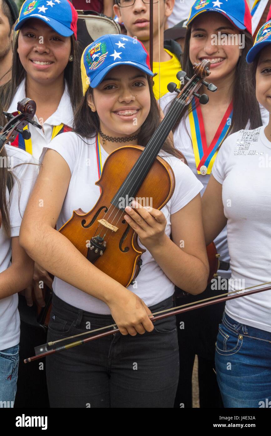 Children musicians congregate in the Francia square of Altamira, in a tribute for the dead in the last protests in Caracas. Musicians and artists marched in homage to the dead in the protests in Caracas. Venezuela. May,7,2017 Stock Photo