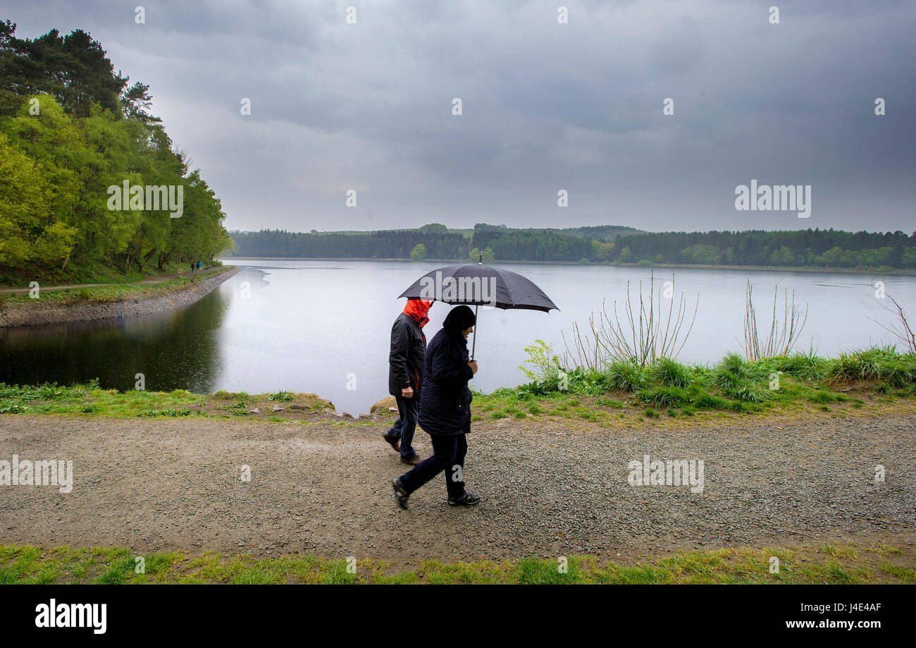 Blackburn, Lancashire, UK. 12th May, 2017. Much needed rain showers didn't deter walkers from enjoying a stroll around the Entwistle Reservoir, Blackburn, Lancashire. Picture by Paul Heyes, Friday May 12, 2017. Credit: Paul Heyes/Alamy Live News Stock Photo