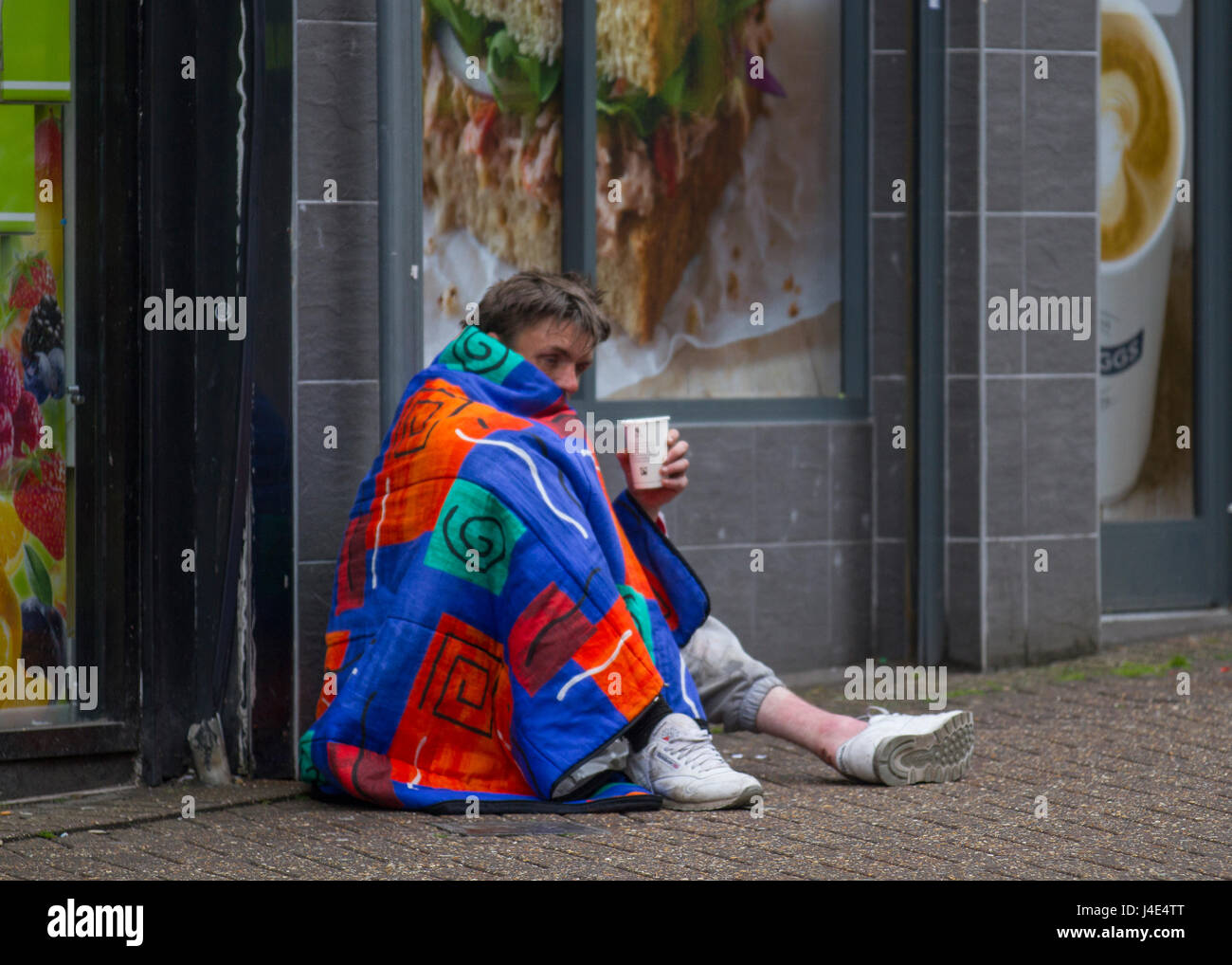 Homeless man wrapped in plastic hires stock photography and images Alamy