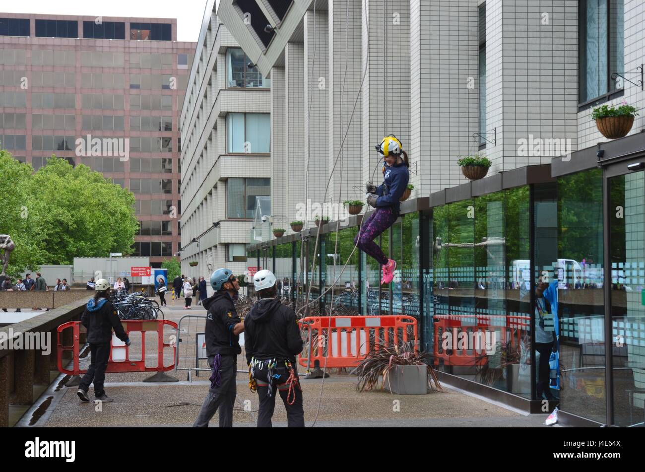 Friday 12th may 1pm  St Thomas hospital london uk  Raising both funds and awareness of the nursing profession with a mixture of stalls and abseiling down the main building staff and volunteers of the hospital Credit: Philip Robins/Alamy Live News Stock Photo