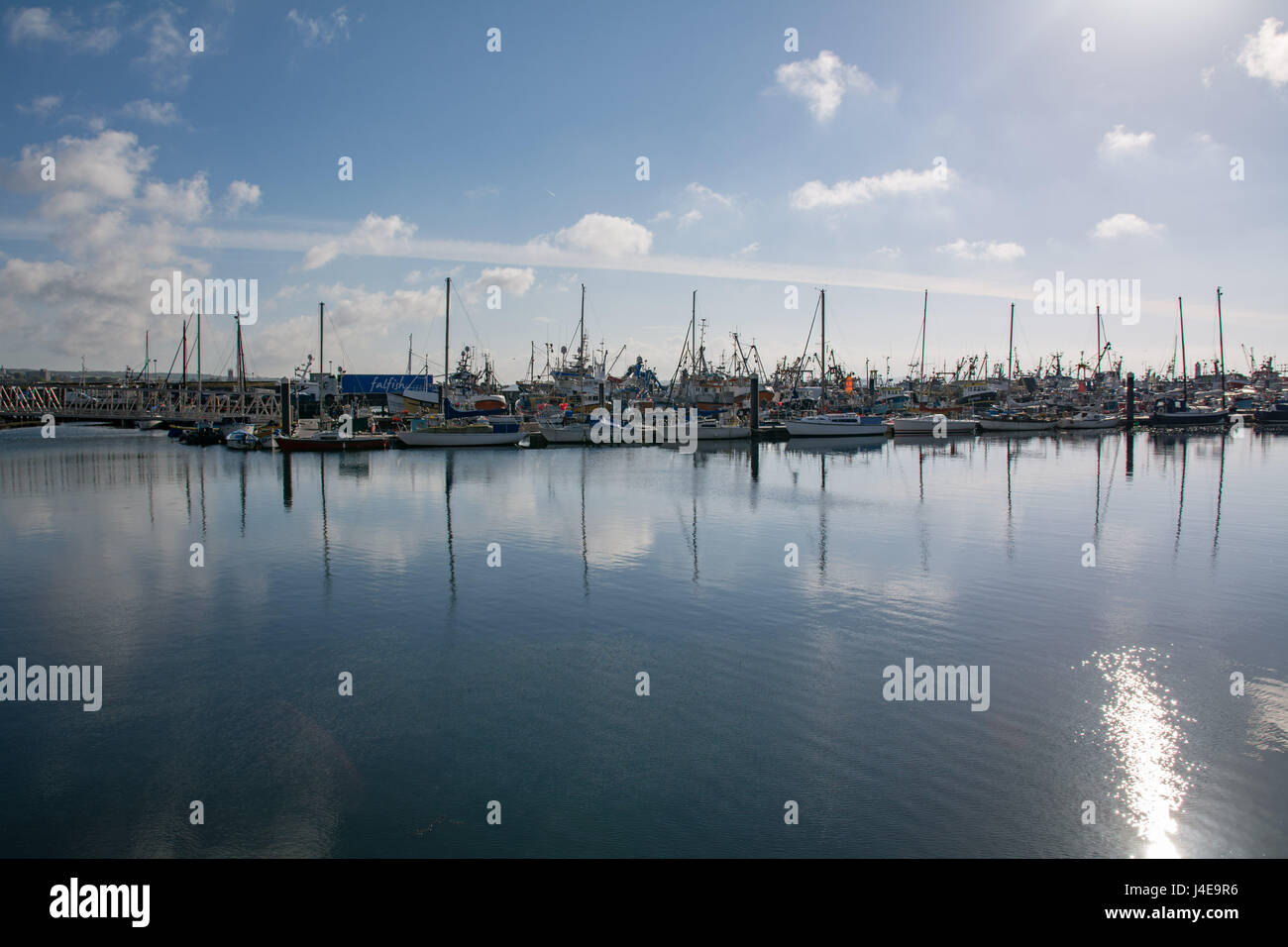 Newlyn, Cornwall, UK. 13th May 2017. UK Weather. After a wet Friday the sun shines this morning over the baots at Newlyn Harbour Credit: Simon Maycock/Alamy Live News Stock Photo