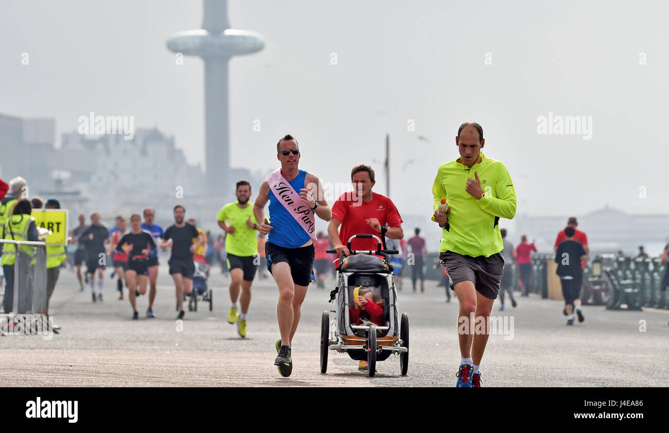 Brighton, UK. 13th May, 2017. Hundreds of people take part in the weekly Park Run fitness event along Brighton and Hove seafront on a dull overcast morning . The forecast is for a mixture of sunshine and showers this weekend in the south with warnings of a water shortage due to a lack of rain this Spring Credit: Simon Dack/Alamy Live News Stock Photo
