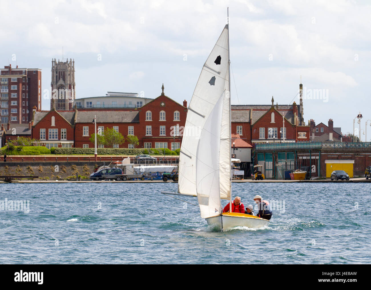 Yachting on a windy Southport, Merseyside.  UK Weather.  Clearing Skies and a Fresh breeze over Marine Lake as Southport Sailing Club stages it 2017 Open Day. The club is fully booked for trial and novice sailors to enjoy one half hour on the resorts Marine Lake, in testing conditions, on a variety of craft. As has been the case for the last few years this coincides with the RYA push the boat out initiative – to nationally get people on the water and interested in sailing! Credit; MediaWorldImage/AlamyLiveNews Stock Photo