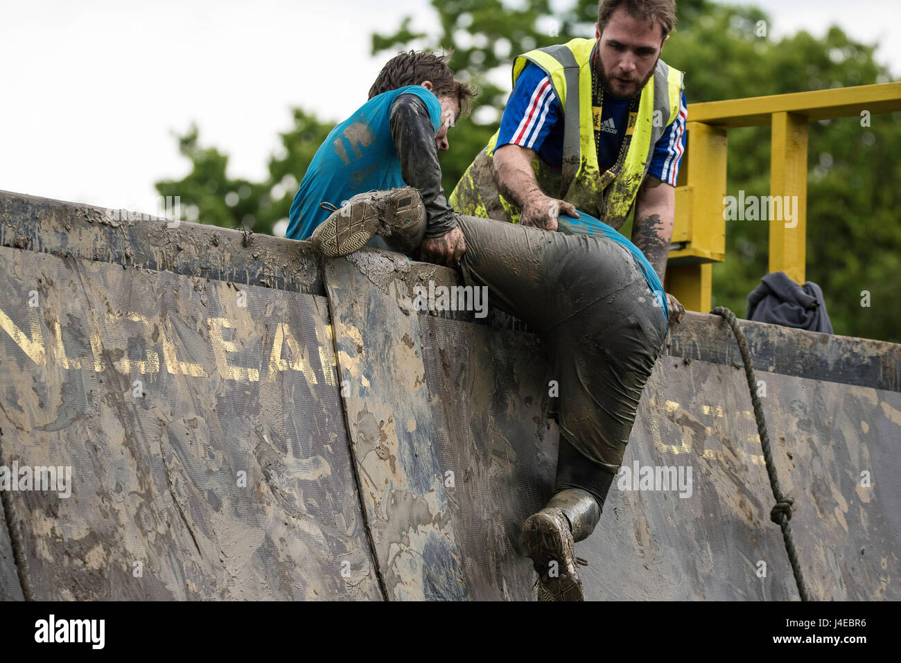 Brentwood, Essex, 13th May 2017; brother helps brotehr   at the, Nuclear Blast race, Brentwood, Essex Credit: Ian Davidson/Alamy Live News Stock Photo