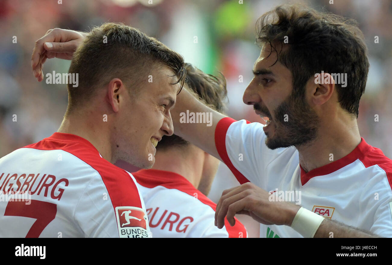 Augsburg, Germany. 13th May, 2017. Augsburg's Alfred Finnbogason (l) and Halil Altintop celebrate the 1:0 goal during the German Bundesliga soccer match between FC Augsburg and Borussia Dortmund at the WWK Arena in Augsburg, Germany, 13 May 2017. (EMBARGO CONDITIONS - ATTENTION: Due to the accreditation guidlines, the DFL only permits the publication and utilisation of up to 15 pictures per match on the internet and in online media during the match.) Photo: Stefan Puchner/dpa/Alamy Live News Stock Photo