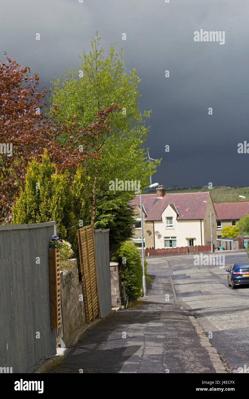 Airdrie, North Lanarkshire, Scotland, UK, Saturday, 13. 05. 2017, weather. Streets of Airdrie during cloudy weather and heavy rain coming changing the weather from very warm and sunny into rainy and cloudy. Credit: Malgorzata Larys/Alamy Live News Stock Photo