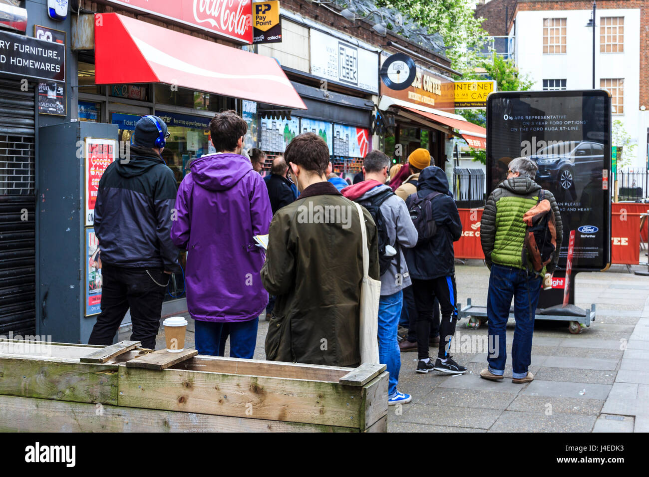 Queue of people waiting in line at the start of Record Store Day 2017 at Flashback Records, Essex Road, London, UK Stock Photo