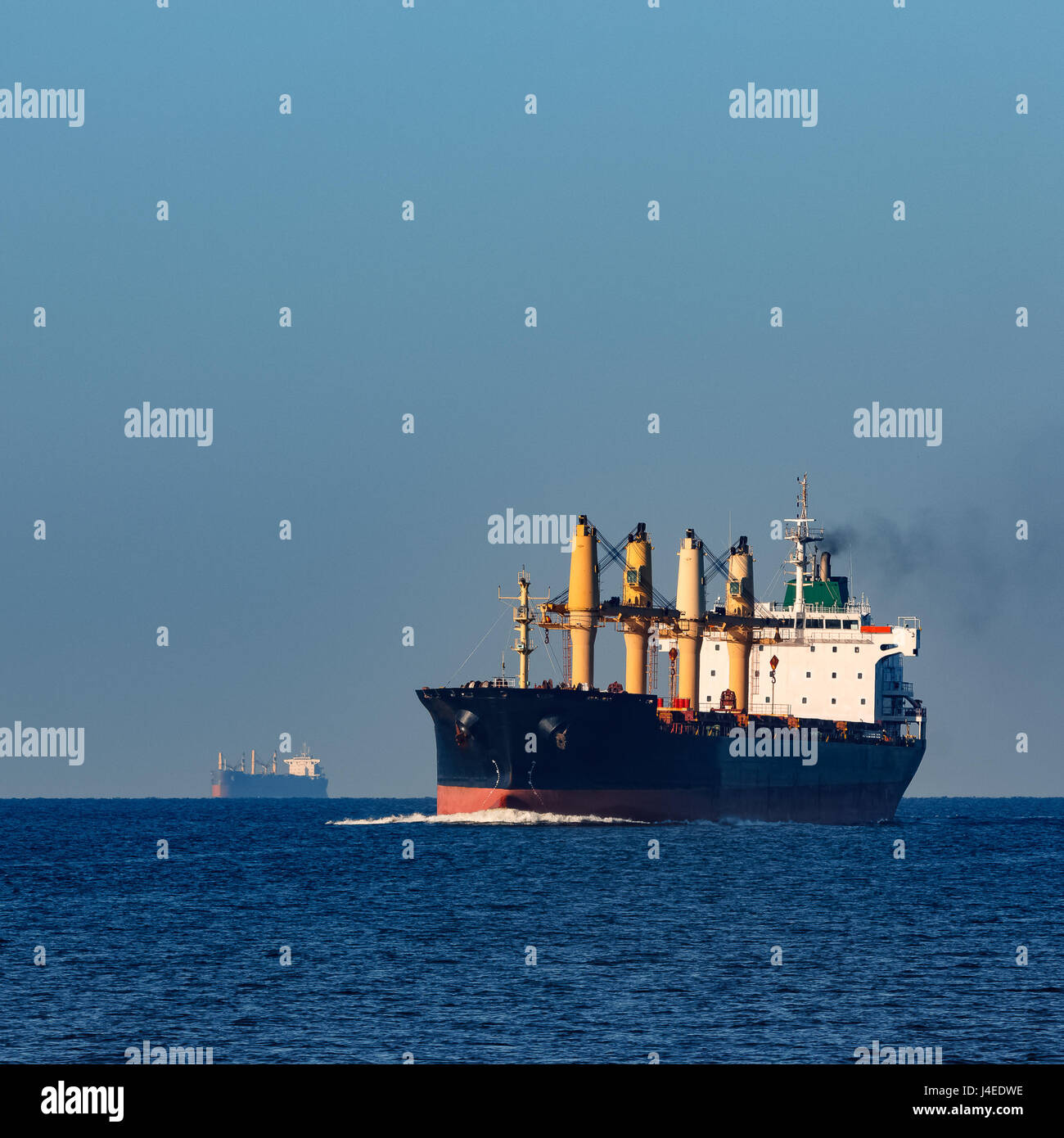 Black cargo ship sailing from the Baltic sea Stock Photo - Alamy