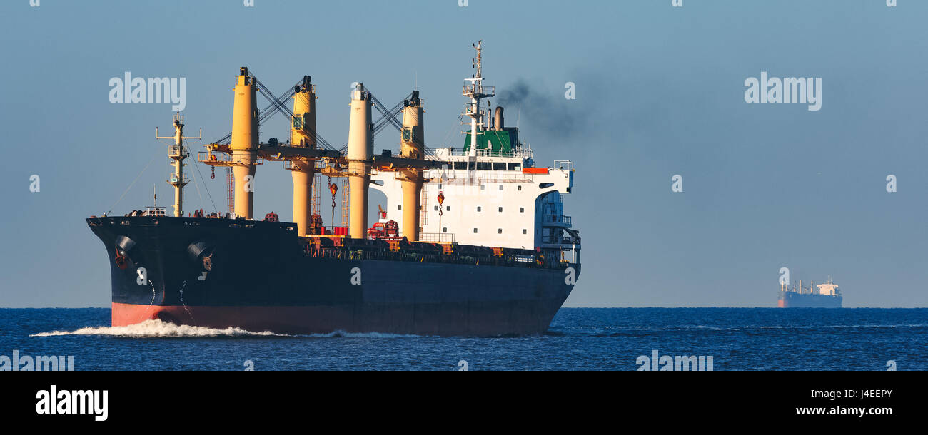 Black cargo ship sailing from the Baltic sea Stock Photo - Alamy