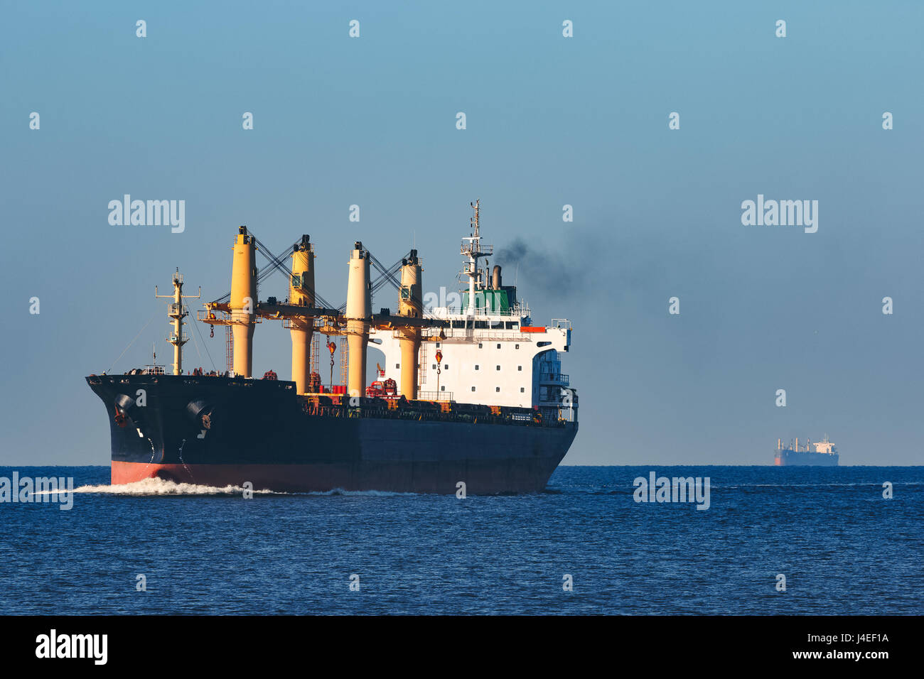Black cargo ship sailing from the Baltic sea Stock Photo - Alamy