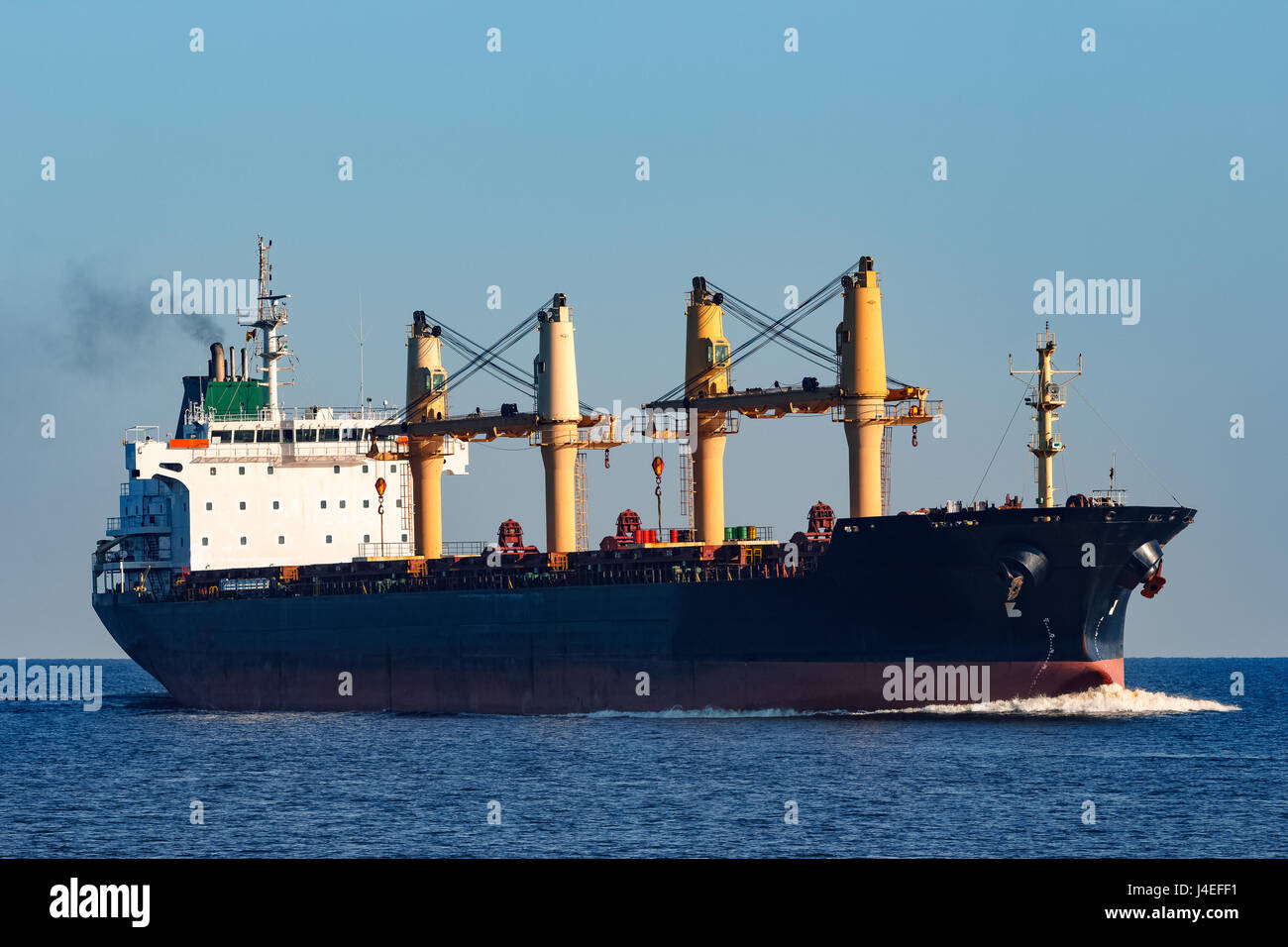 Black cargo ship sailing from the Baltic sea Stock Photo - Alamy