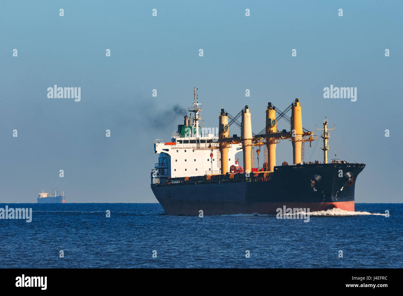 Black cargo ship sailing from the Baltic sea Stock Photo - Alamy