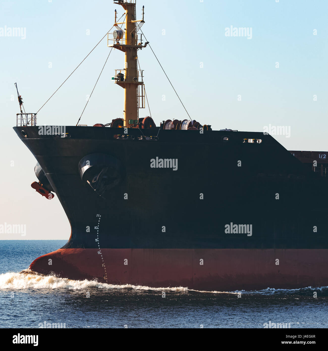 Black cargo ship sailing from the Baltic sea Stock Photo - Alamy