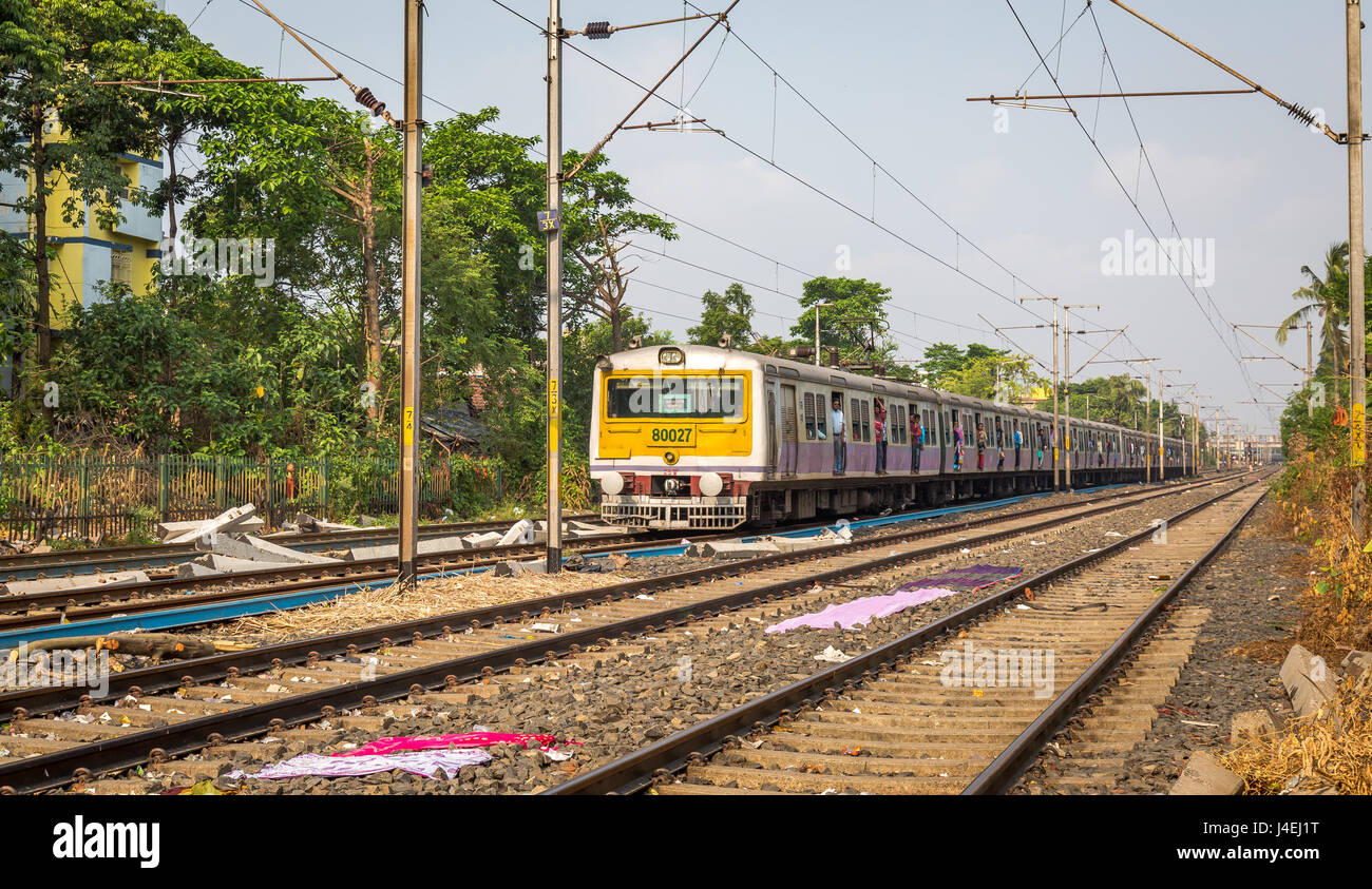 City local train of the Indian Railways moving with passengers from one station to another at Kolkata, India. Stock Photo