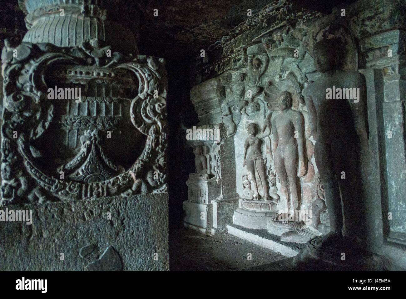 Jain thirthankaras carved in stone inside one of the cave temples in Ajanta and Ellora in Maharashtra, India Stock Photo