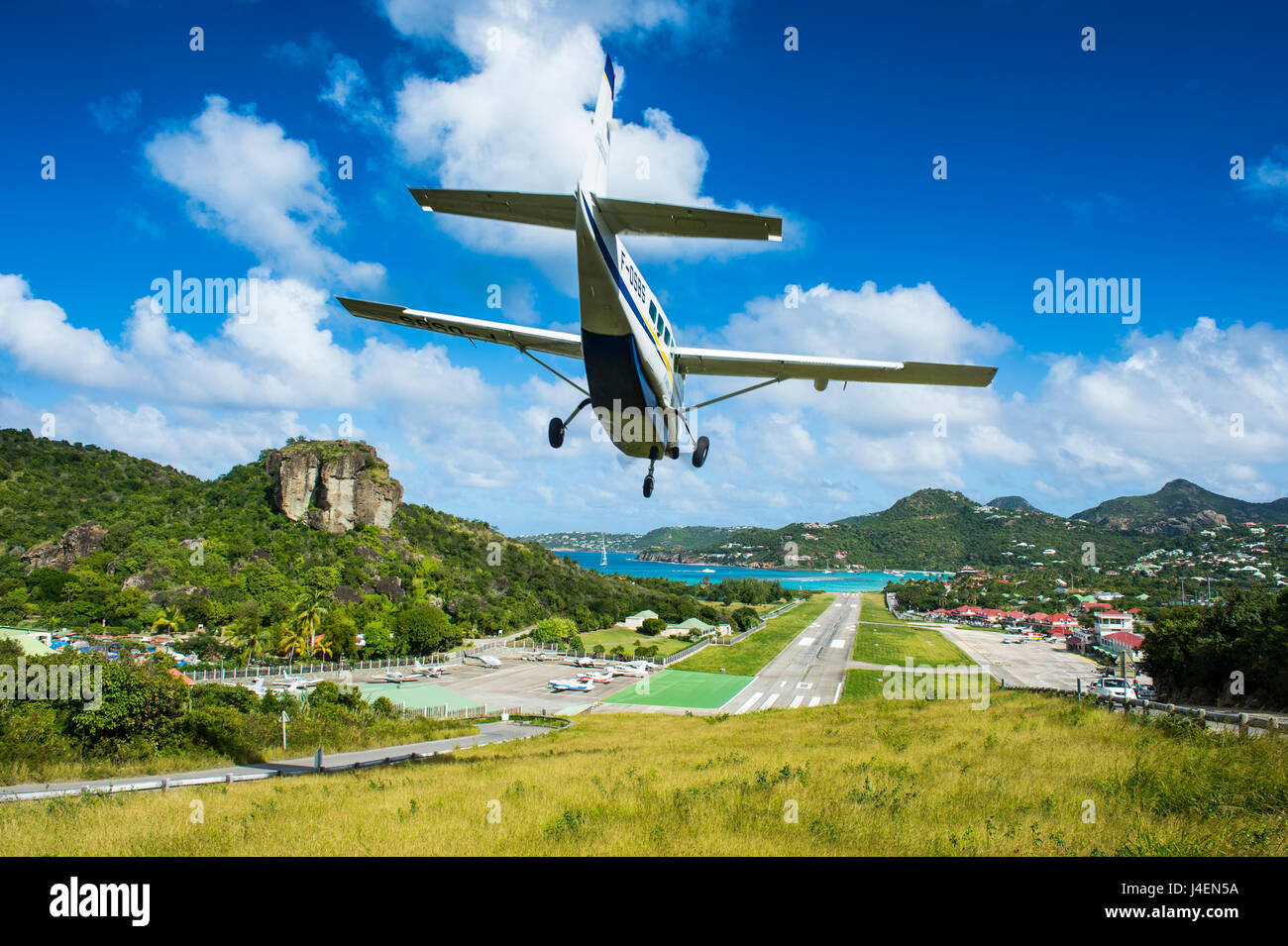 Small airplane landing at the airport of St. Barth (Saint Barthelemy), Lesser Antilles, West Indies, Caribbean, Central America Stock Photo