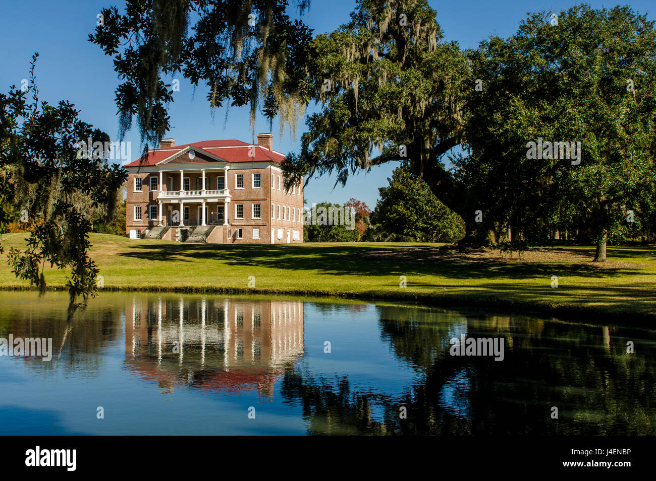 Spanish moss covered tree and the Drayton Hall Georgian plantation house, Charleston, South Carolina, USA, North America Stock Photo