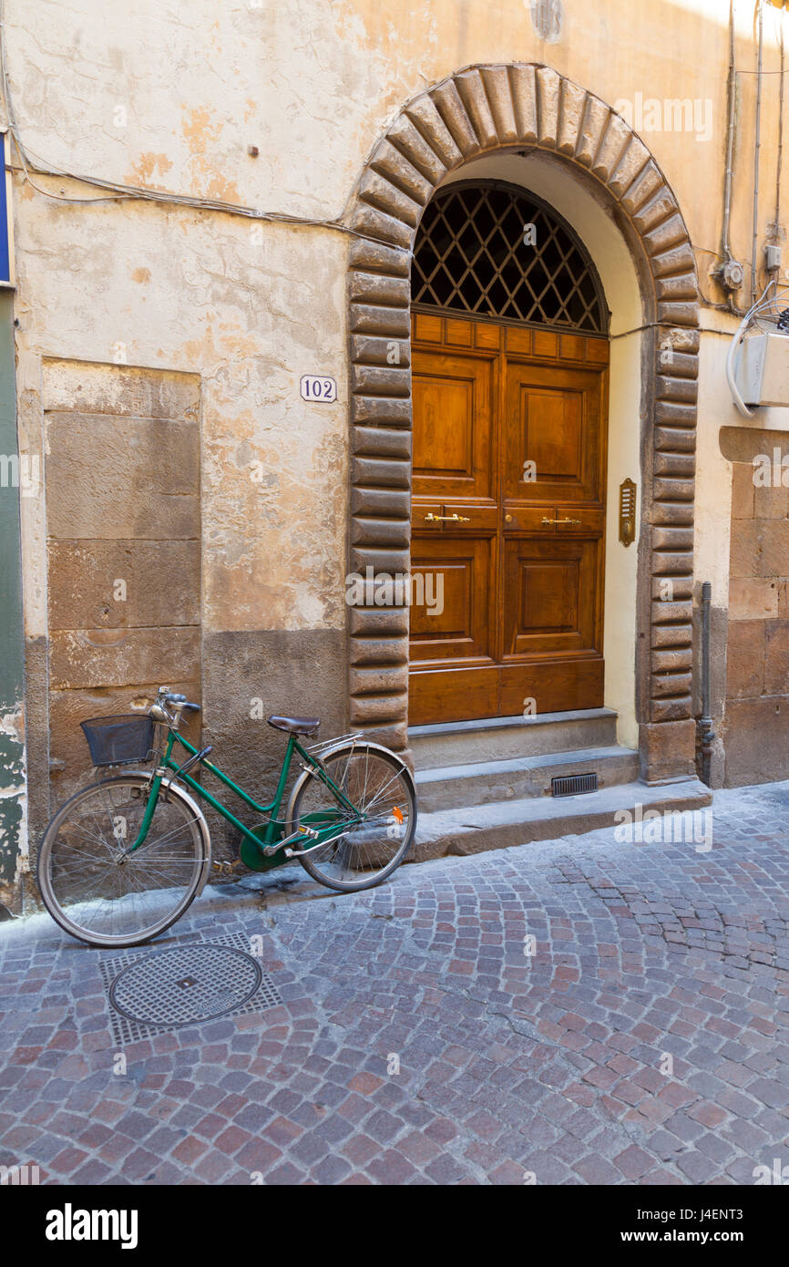 Bicycle parked outside front door, Lucca, Tuscany, Italy, Europe Stock Photo