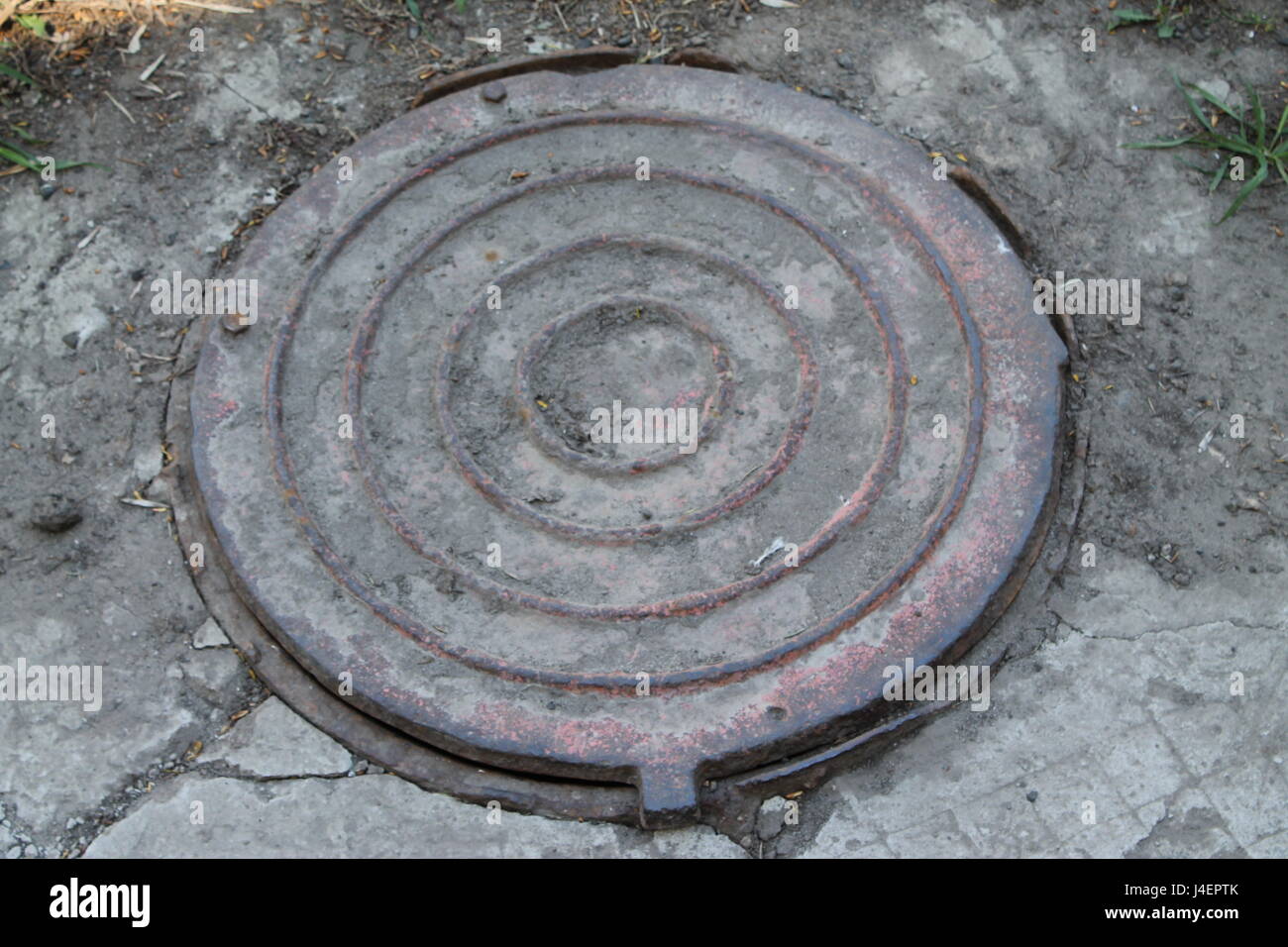 Drain cap art on the surface of sewer cover on the walk way takayama