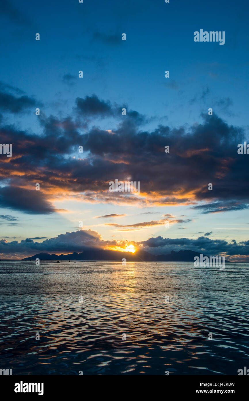 Dramatic sunset over Moorea, Papeete, Tahiti, Society Islands, French Polynesia, Pacific Stock Photo