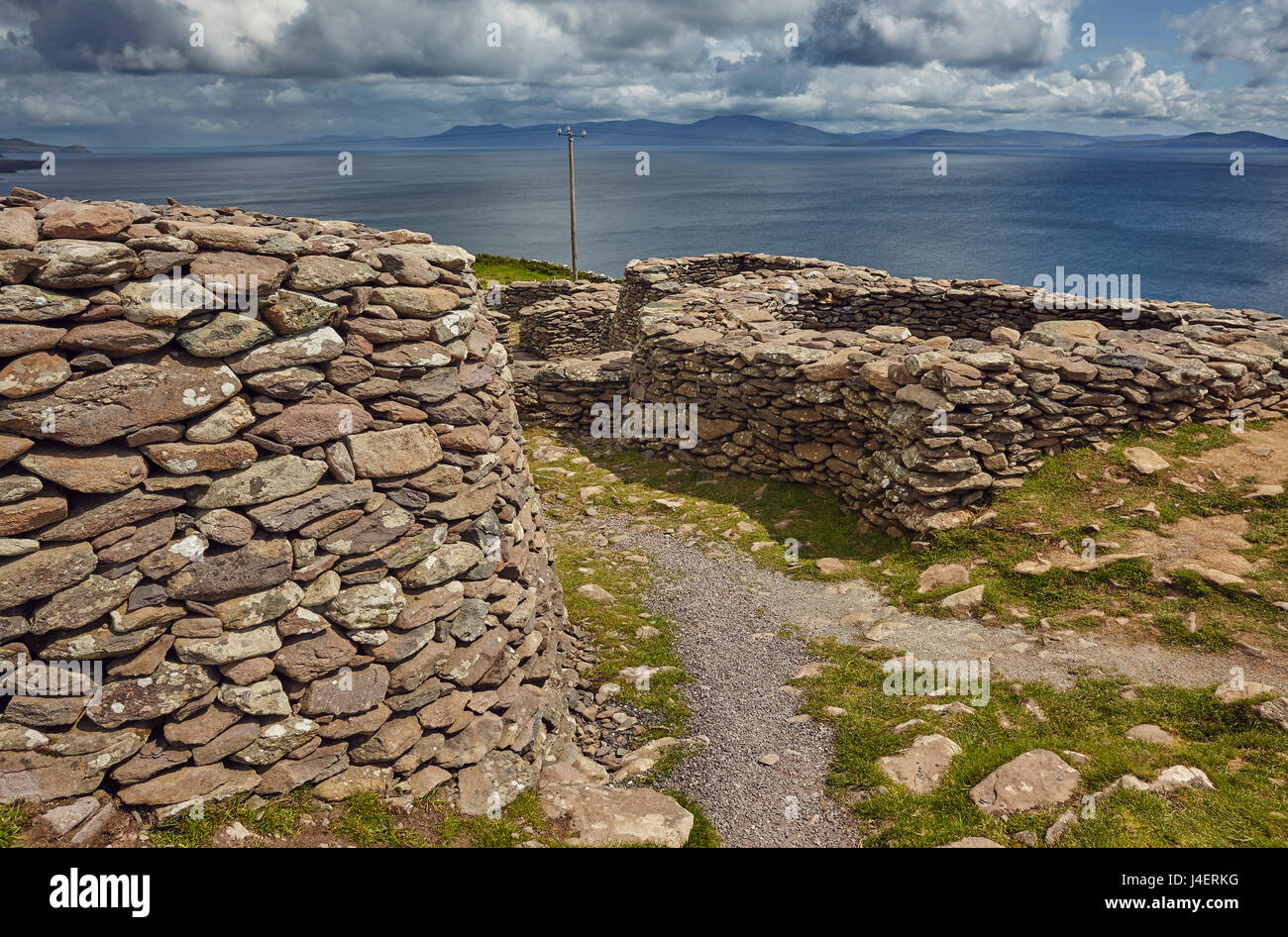 The Fahan group of beehive huts, on the southwest coast of the Dingle Peninsula, near Slea Head, County Kerry, Munster, Ireland Stock Photo