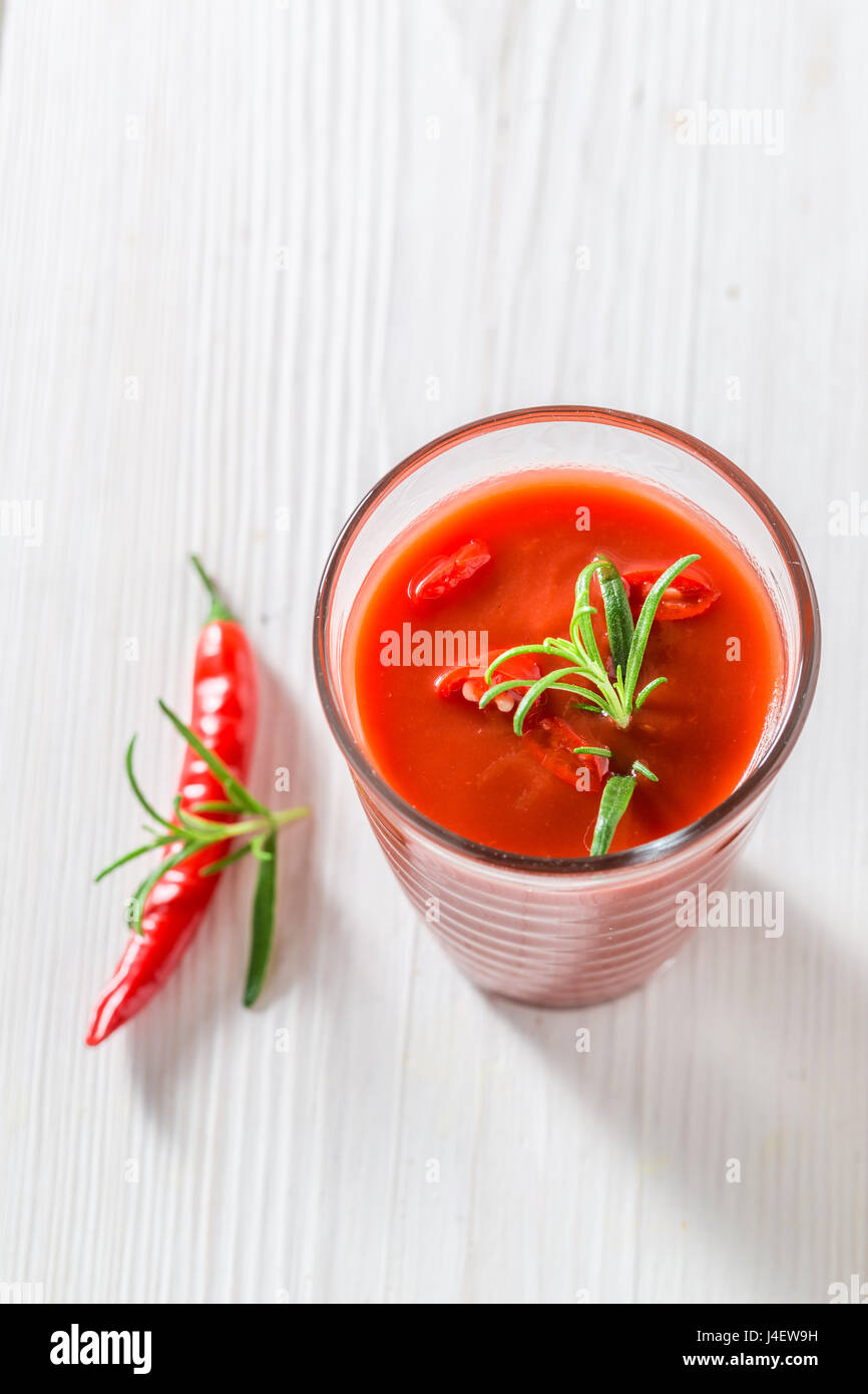 Spicy cocktail with tomatoes and chilli peppers Stock Photo