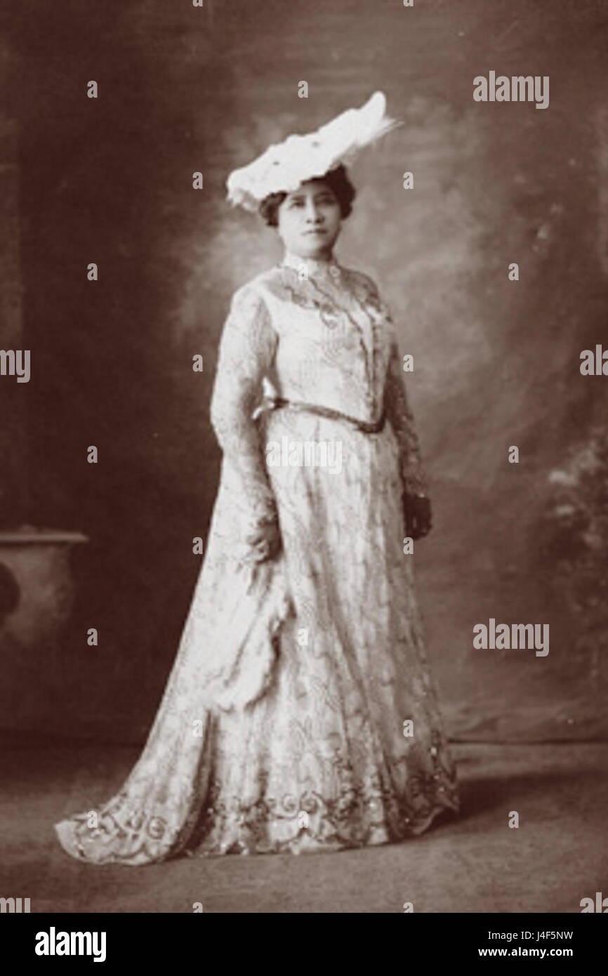 This portrait of Queen Liliuokalani, the last monarch of Hawaii, shows her wearing a plumed hat and facing front. It reflects the regal attire and the dignity of the Hawaiian royal family during her reign. Stock Photo