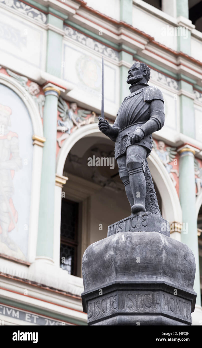 Sculpture executioner with a sword on top of the pillory. Poznan. Poland Stock Photo