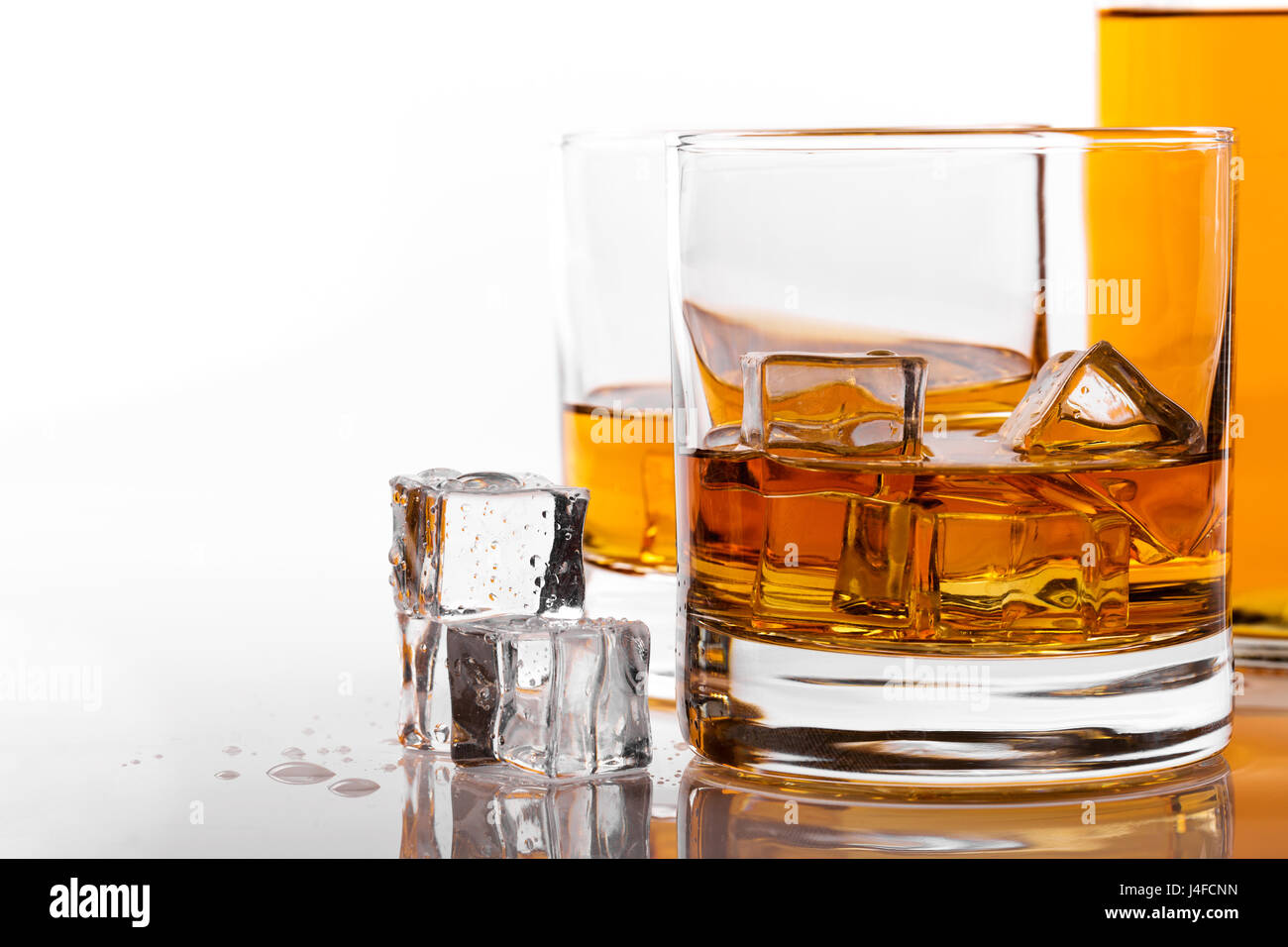 whiskey glass with ice on white background Stock Photo