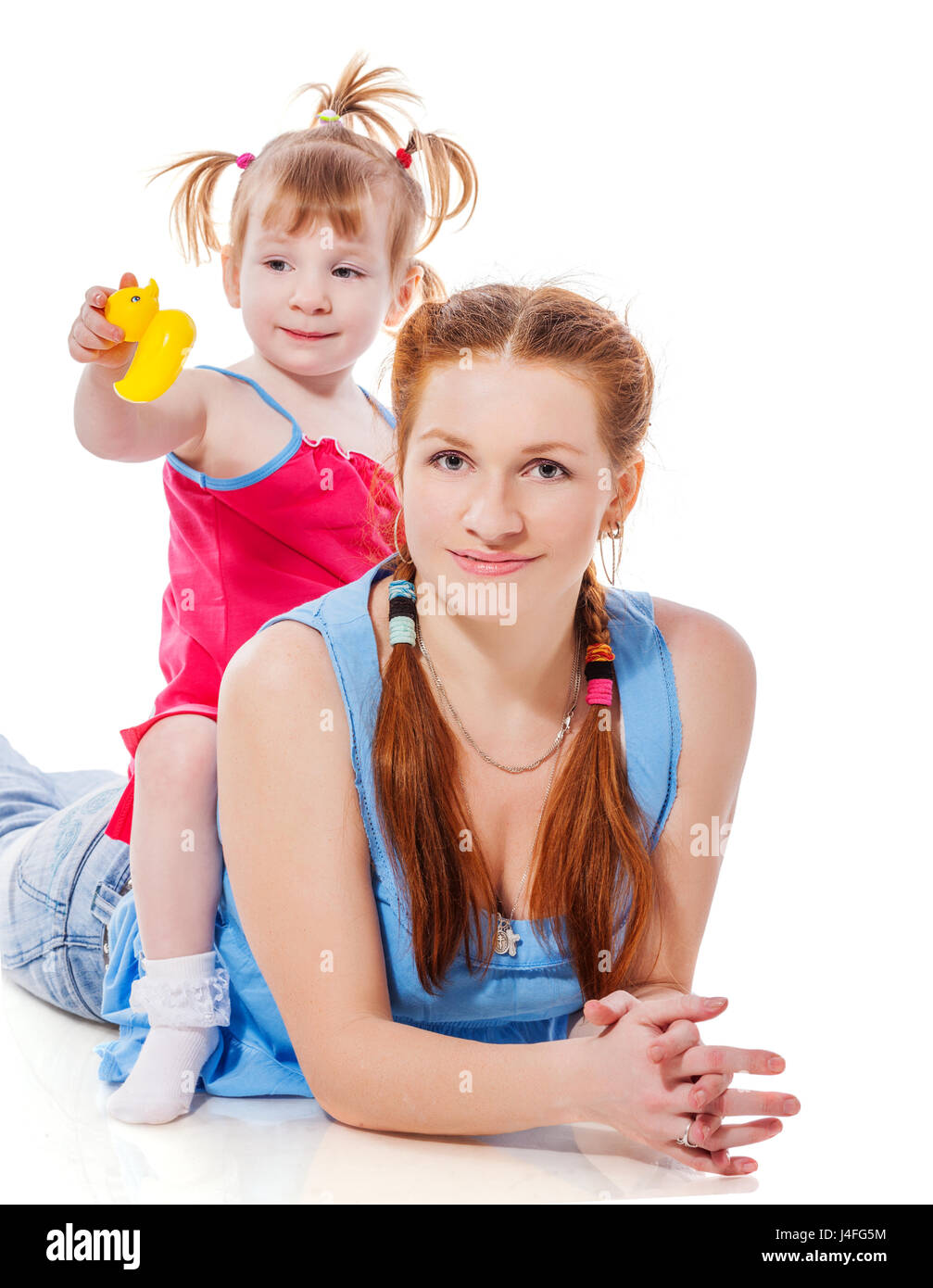 Mother playing with child holding pyramid isolated on white Stock Photo ...