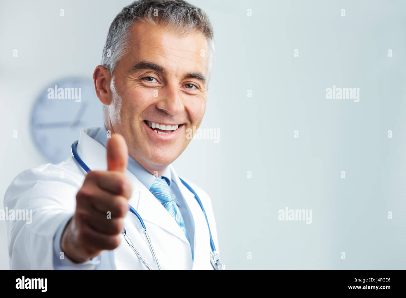 Middle aged doctor showing hi-res stock photography and images - Alamy