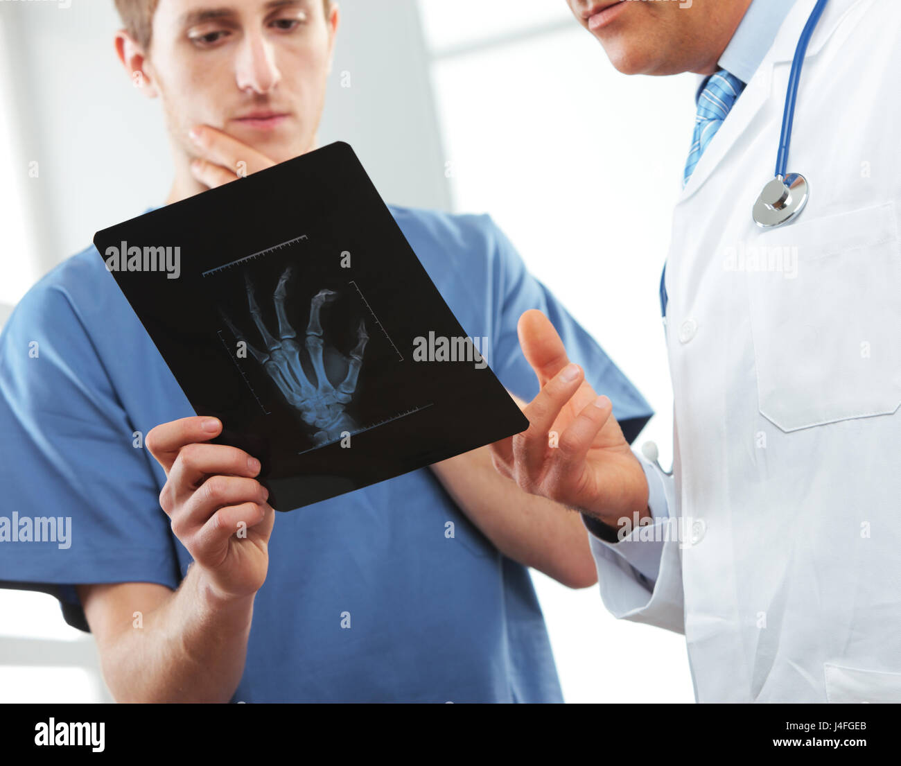 Doctor and nurse looking at x ray Stock Photo - Alamy