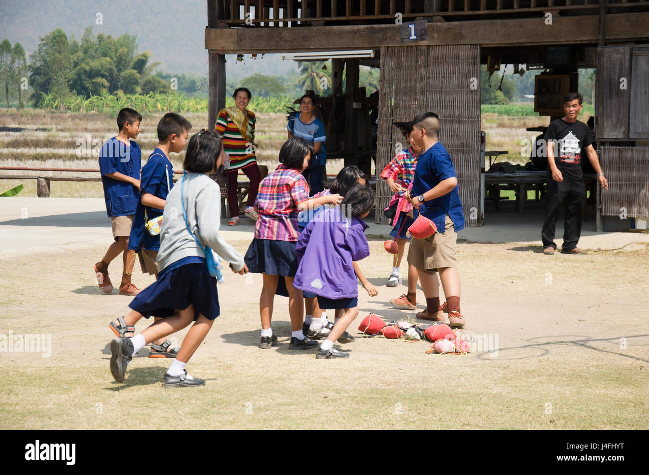 Thai student visit and educational tour at Tai Dam ethnic museum house and playing tradition game of Tai Dum people at Chiang Khan on February 21, 201 Stock Photo