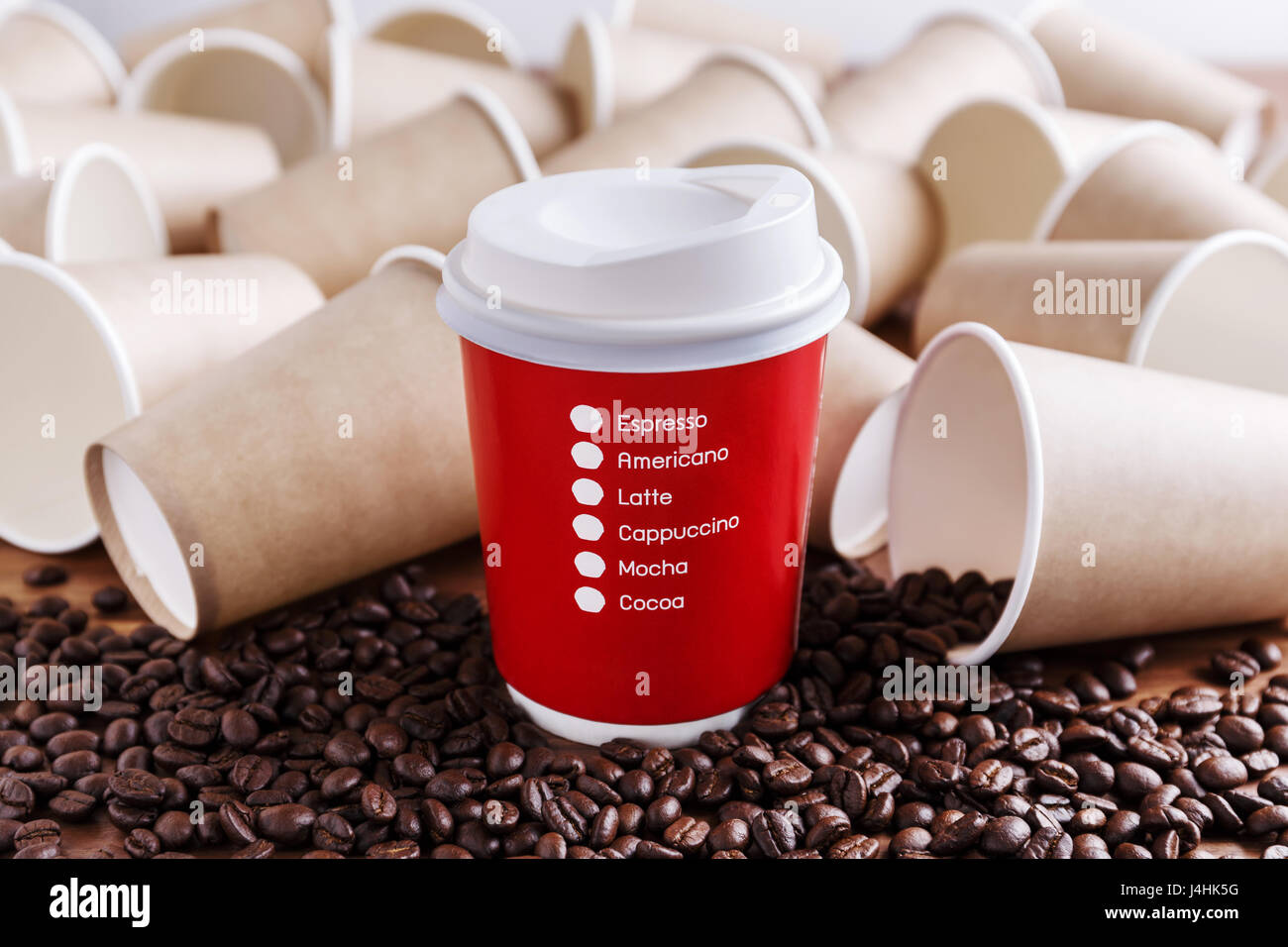 Red paper coffee cup with coffee beans and brown paper cups background Stock Photo Alamy
