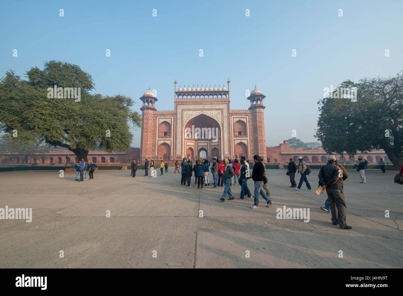 Tourists walking around the Taj Mahal complex entrance in Agra, India. Stock Photo