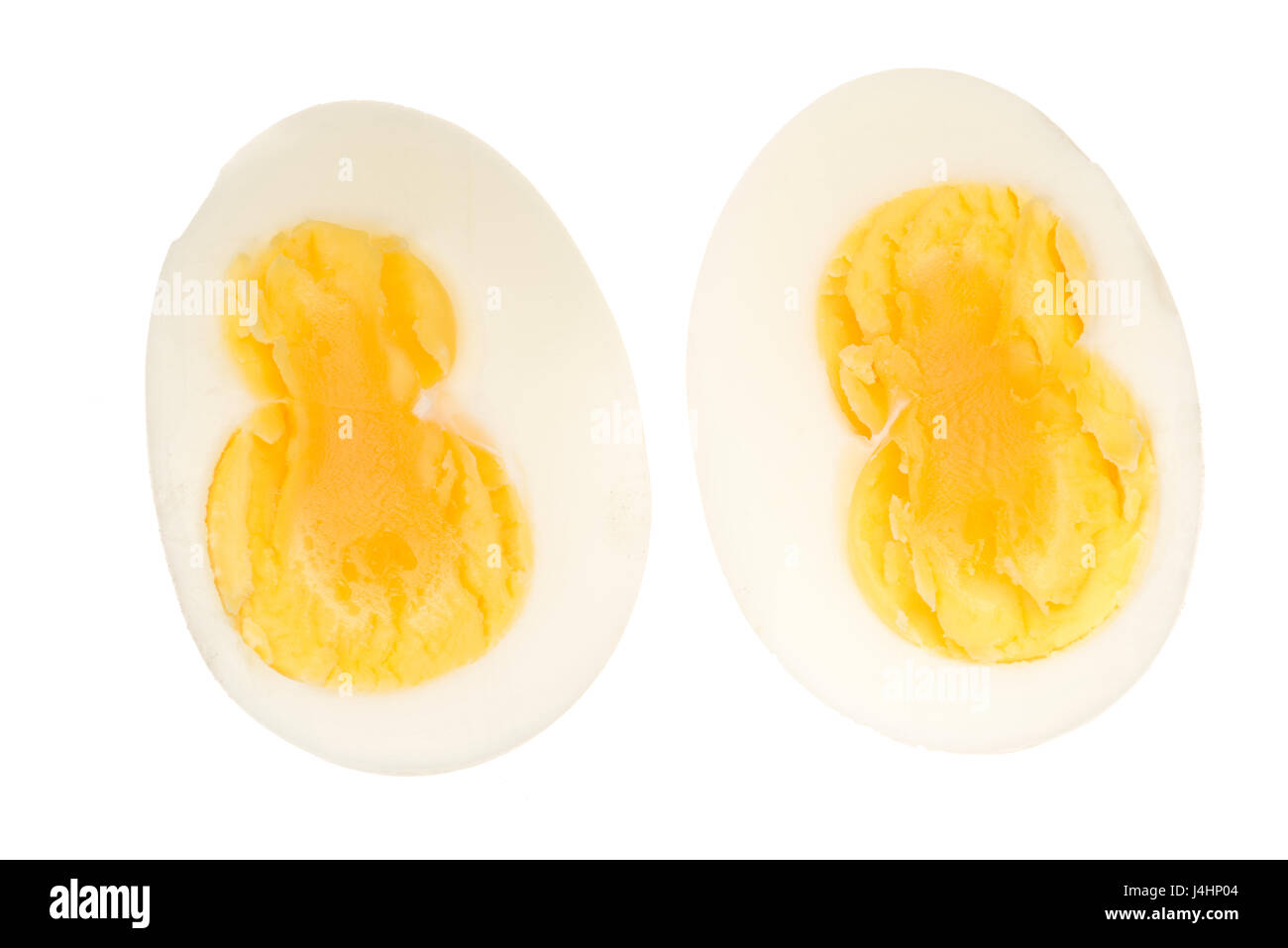 Double yolk hard boiled egg, cut out or isolated against a white