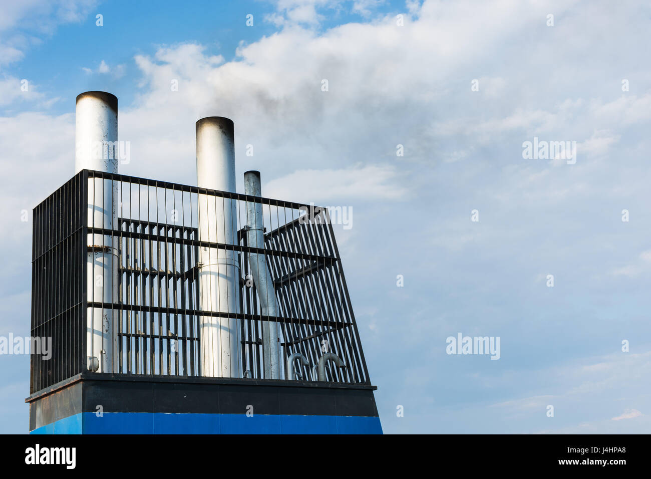 Aboard, chimney of a ferry or cruise ship, black smoke. Pollutes the ...