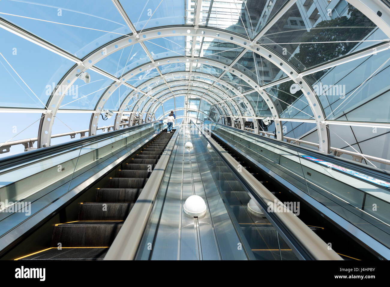 View of the spectacular escalator in Japan Building, a modern high rise skyscraper in the Tokyo in Japan. Stock Photo