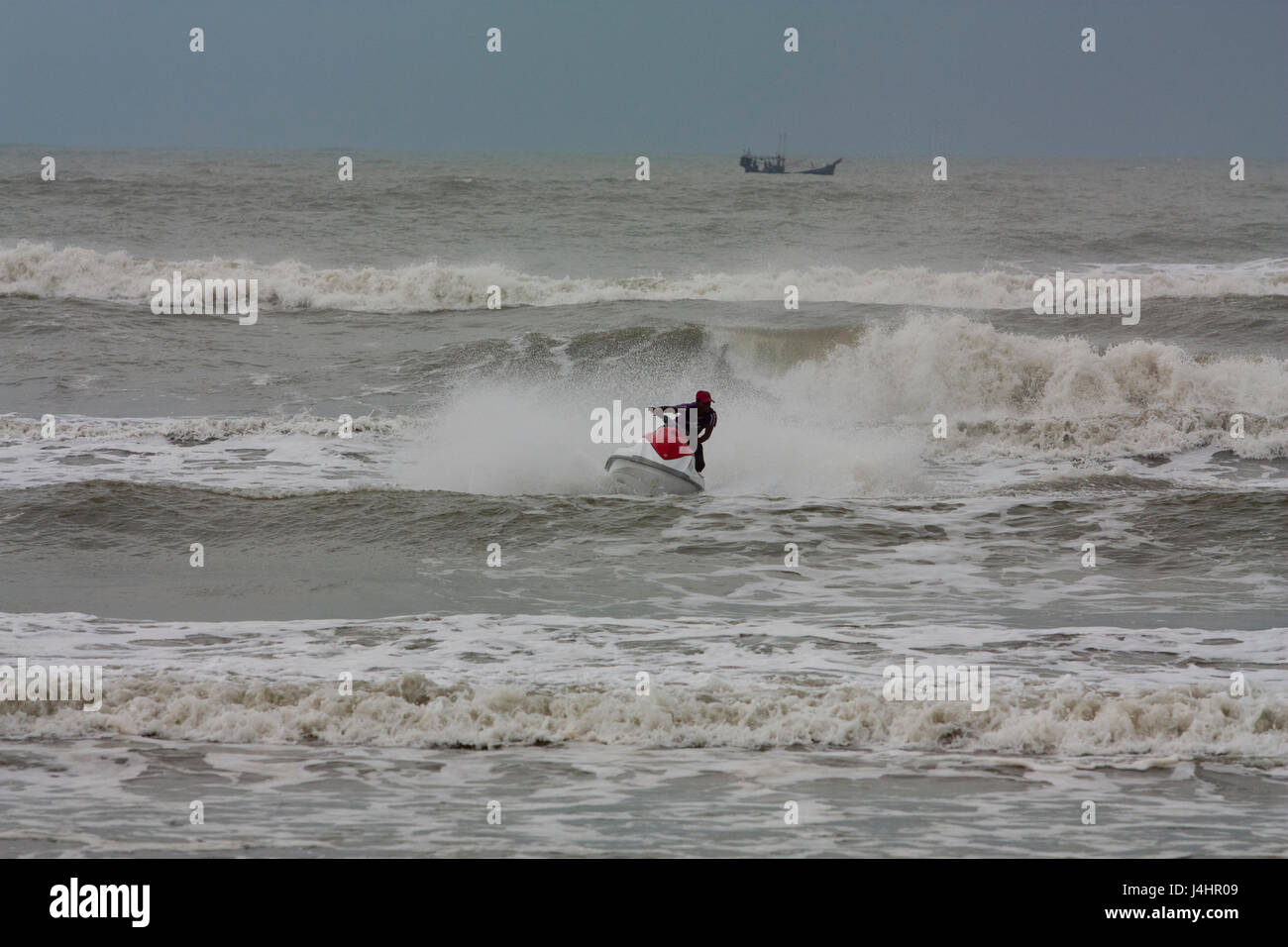 Tourist rides jetski on the Bay of Bengal at the Cox’s Bazar sea beach ...