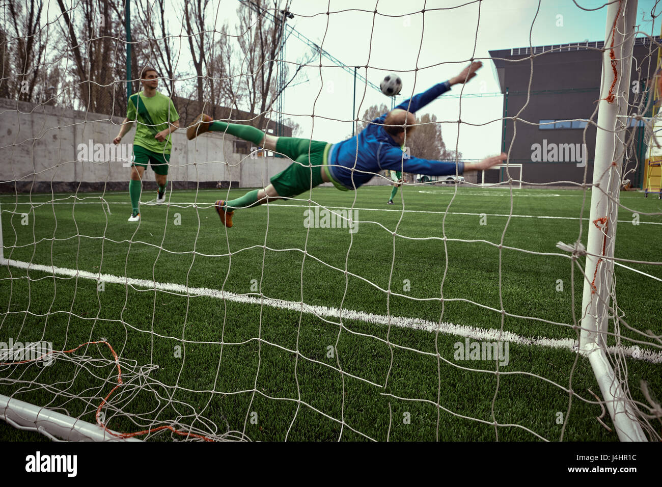 Soccer football goalkeeper making diving save Stock Photo Alamy